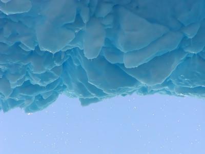 Droplets falling from the top of the melting iceberg archway