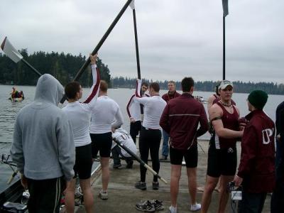 A crowded dock, bringing up oars... standing around... etc.