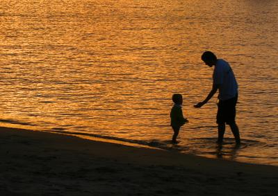 Man and son at Palm Beach sunset