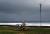 Lady on Esplanade before storm