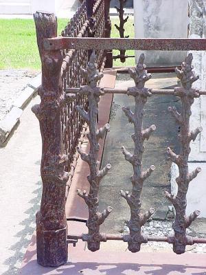 WroughtIronWoodFence.jpg