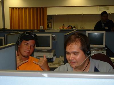 Evan from Kailua High works with Ron on a call.