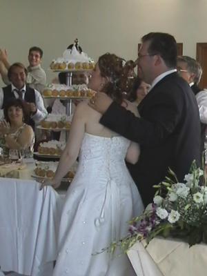 The bride and groom with their wedding cake.