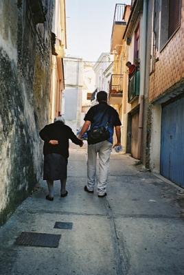 Clint walks with Nonna back up to her house.  The 'streets' of Melilli are all quaint, some so narrow only a mini will fit.