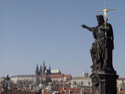 Statue on Charles Bridge, Prague Castle in the background