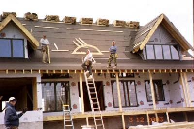 One is on the ground, one on the ladder, the boss at the dormer, and one to the right of the eyebrow window - it take a village