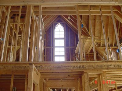 The Gothic window looking up into the loft bedroom