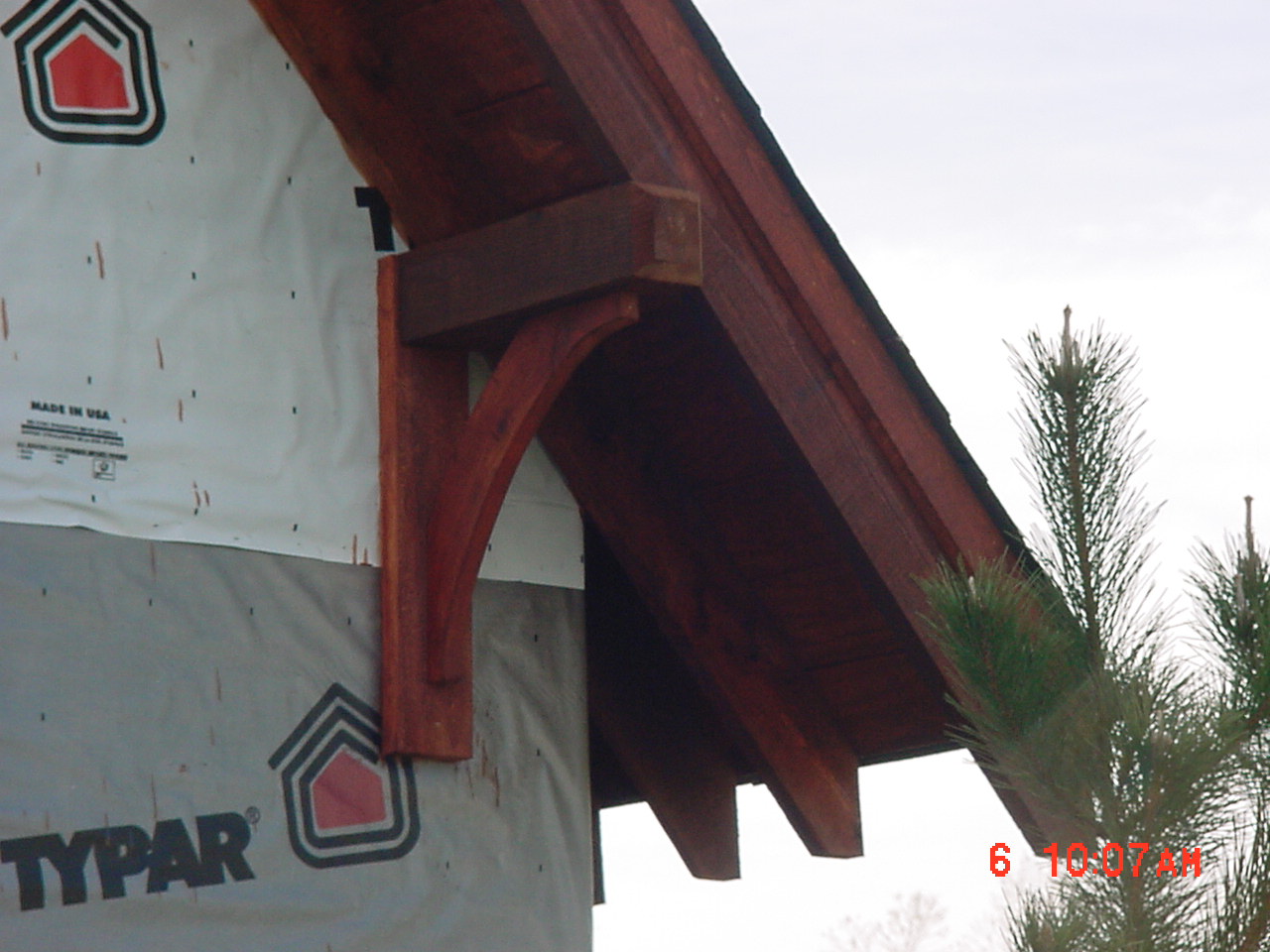Knee supports for the 2 overhangs ... 6x6 upper post, 2x6 back brace and the curved piece was cut out of a 2x12