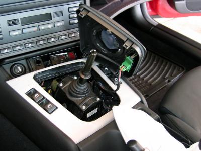 Gently lift the shifter plate and disconnect the SMG switch connector