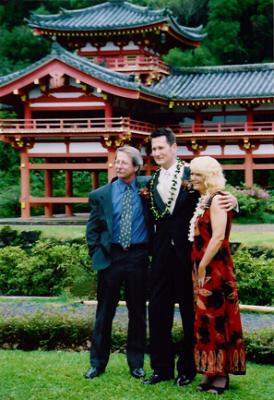 Justin with his Mom and Dad.JPG