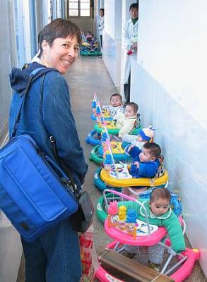 30178-Cindy in Hall with Babies.jpg