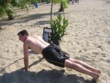 Rico doing pushups for Gloria