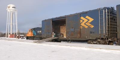 Snowmobile car on mixed train