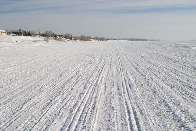 Moose River almost totally covered by snowmobile tracks