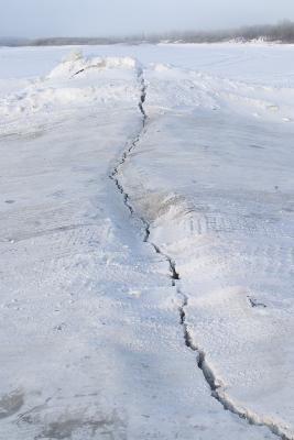 Crack across the river road due to tide