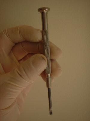 I would recommend this type of screwdriver for turning the screw on the Latham device.