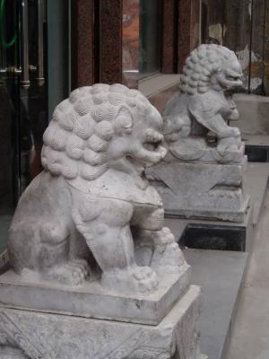 Stone lions in a well to do hutong. Restored and transformed into an art collectors haunt.