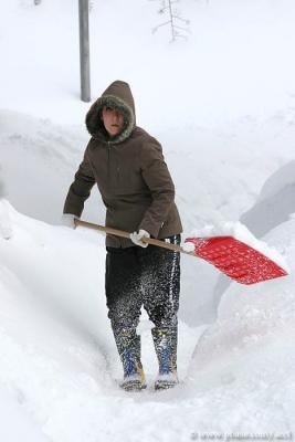 Cleaning up the snow at the door.jpg