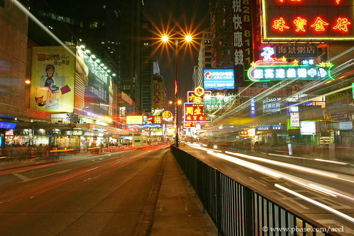 Look like a crazy man, taking pictures in the middle of a street.