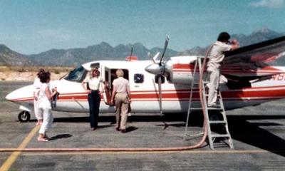 Nancy Neel with Lewis B. Bud Maytag's Turbo Commander N8LB and friends during refueling at La Paz, Mexico