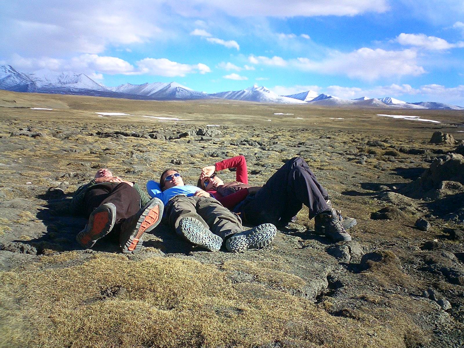 Roger, Kate & Nerys taking a nap while one of the land cruisers is being repaired.