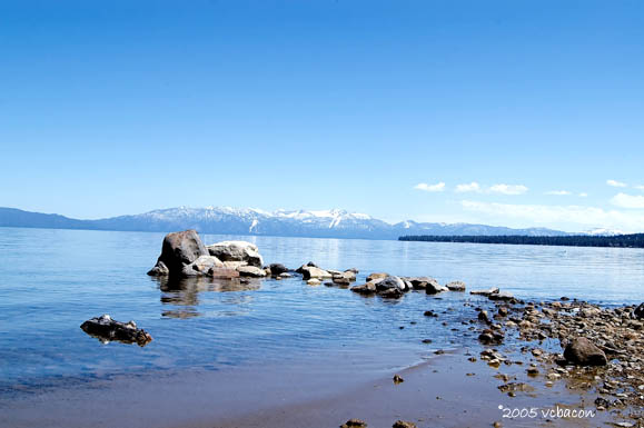 Pristine Shores and Snowy Mountain Views