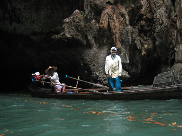 Fishermen with a small boat taking shelter in the cave, Ko Hong