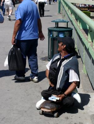 Beggar On Skateboard