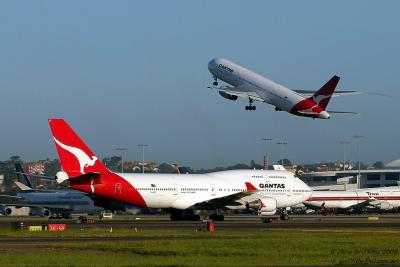 VH-OEC waiting on Twy Alpha for company traffic to depart Rwy 25