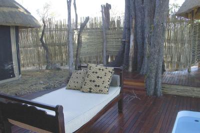 Our outdoor shower (the faucet and showerhead are on the left side of the big tree)