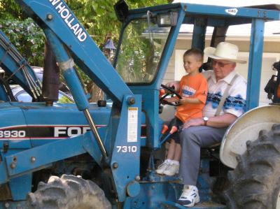 Tommy Great Grandpa on Tractor.jpg