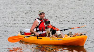 Man, Dog, Boat  & Cooler