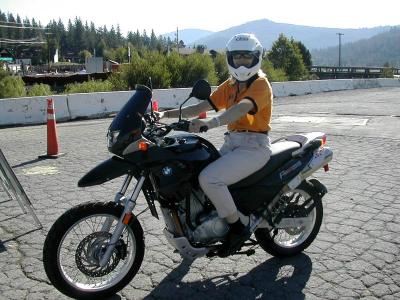 Jane stops for a pose aboard a F650GS