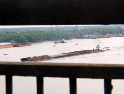Tug on the River through the Bridge  Railing