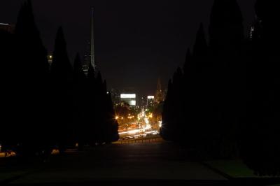 A wider view of Swanston St by night