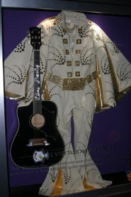 replica of Elvis' Gibson dove guitar and a jump suit