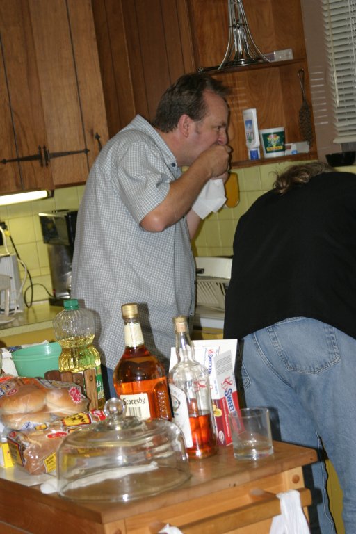 Mike sneaks into the kitchen to raid the rest of the chicken