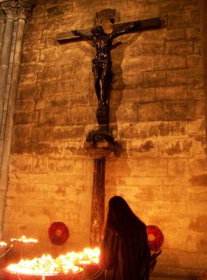 A Woman Praying Inside Notre Dame Cathedral