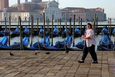 Walking past the stabled gondolas