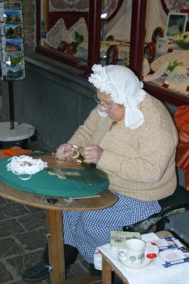 Demonstrating the ancient craft of lace-making