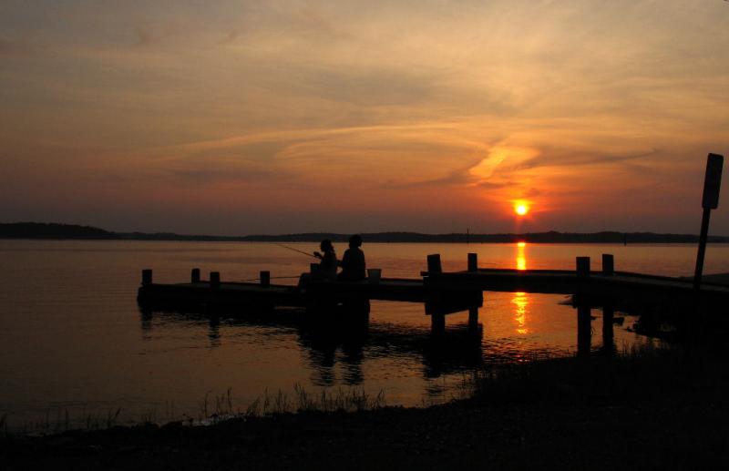 Fishing On The Dock Of The Lake *