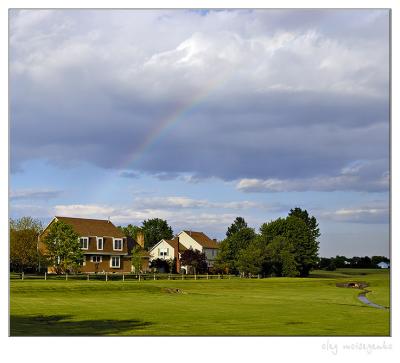 Suburb landscape with rainbow