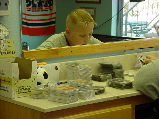 Bills son Dylan checking out Bills trading cards