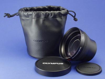 This is the Olympus TCON-14B. It is a 1.45 teleconverter, and this baby is big. The camera end is 62mm and the filter end is 86mm. The lens is 3 1/2 inches across and about 2 1/3 long. It is a very high quality lens and takes very sharp pictures.

They cost around $130 if you look around.

By Bill Huber
