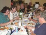 Nola, Willough, and Cheryl R eating.
