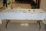 Table full of name tags and miscellaneous material
