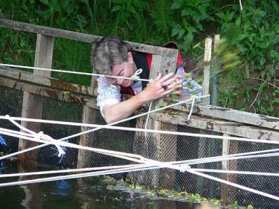 P1020563 cleaning the weir.jpg