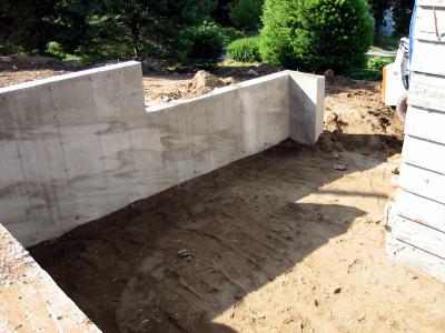 Filling in of soil around addition.