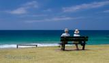 Couple on bench at Palm Beach