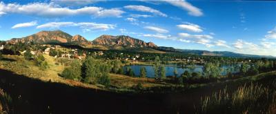 This is taken from the Fairview High School Parking Lot. It was taken with a panoramic camera using 120 film. It shows the Flatirons in the background. This is in South Boulder